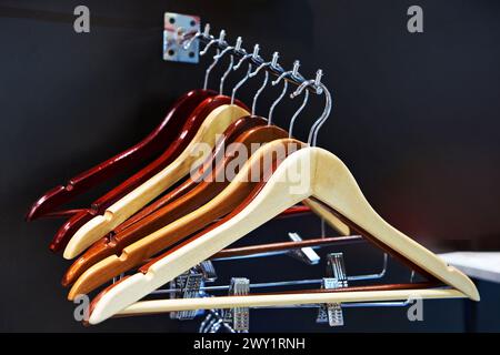 Coat hangers on clothes rail in the store Stock Photo