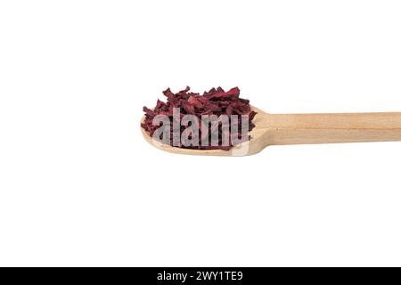Dried beetroot slices on wooden spoon isolated on white background. Stock Photo