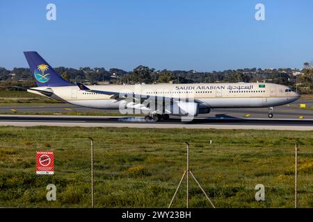 Saudi Arabian Airlines Airbus A330-343 (REG: HZ-AQB) arriving in the morning for maintenance at LTM. Stock Photo