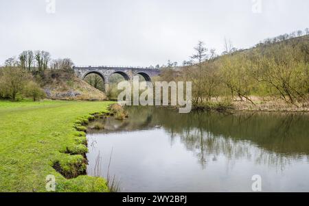 A multi image panorama of the Monsal Head Bridge pictured from the edge of the River Wye looking up at the Monsal Trail. Stock Photo