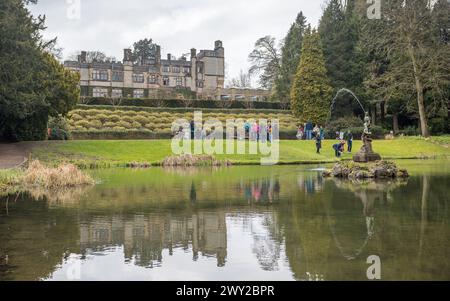 Thornbridge Hall pictured behind the pond, visitors and gardens seen in March 2024 near Bakewell, Derbyshire. Stock Photo