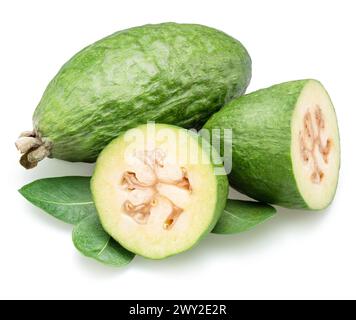 Feijoa fruits with leaves and feijoa cross sections isolated on white background. Stock Photo
