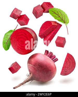 Red beetroot and beetroot slices levitating in air on white background. Stock Photo