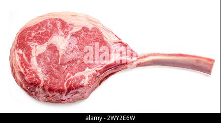 Raw rib steak with bone or tomahawk steak isolated on white background. Stock Photo