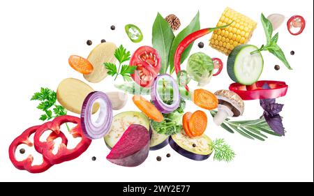 Pieces of fresh vegetables and herbs isolated on a white background. Organic food concept. Clipping path. Stock Photo