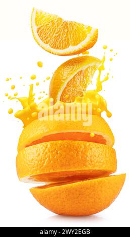 Sliced orange fruit splashing around orange juice on the white background. Stock Photo