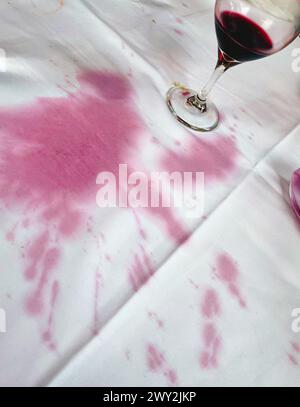 Close-up of a white tablecloth with a red wine spill, 2024, USA Stock Photo