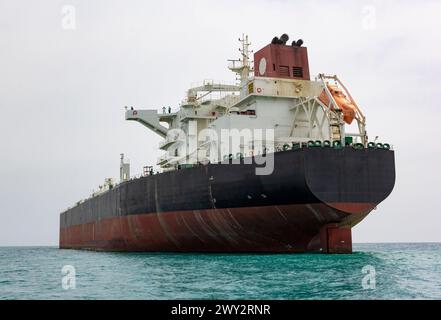 An oil tanker ship in the Persian Gulf, waiting to receive oil barrels. Iran exports oil from the Persian Gulf to South Asia and Eastern countries. Stock Photo