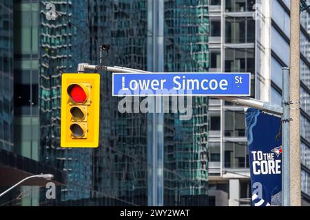 Stop light and street name sign in Simcoe Street, Toronto, Canada Stock Photo