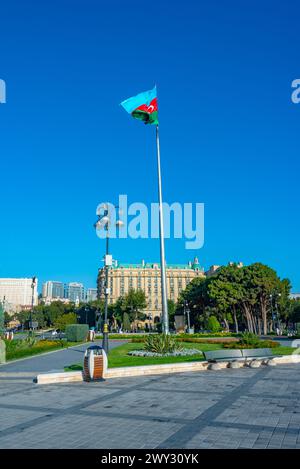 Flagpole with flag of Azerbaijan at seaside promenade in Baku Stock Photo