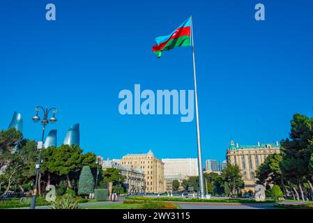 Flagpole with flag of Azerbaijan at seaside promenade in Baku Stock Photo