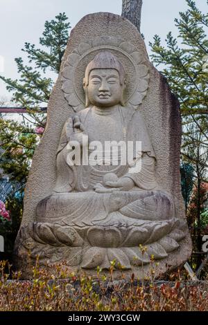 Seated Buddha carved in rock at Manbulsa Temple in Yeongcheon, South Korea Stock Photo