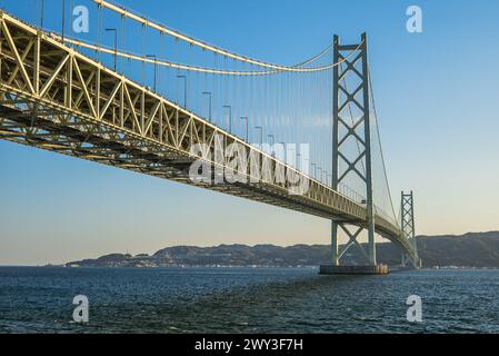 Akashi Kaikyo Bridge links Kobe on Honshu to Iwaya on Awaji island in Japan Stock Photo