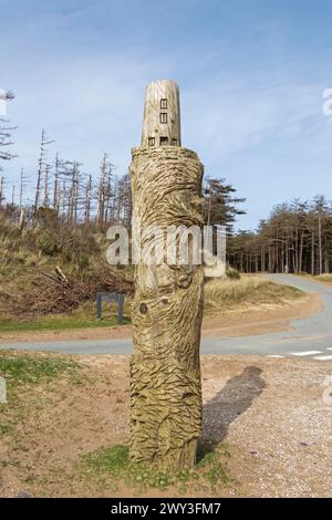 Wooden artwork, lighthouse, LLanddwyn Bay, Newborough, Isle of Anglesey, Wales, Great Britain Stock Photo