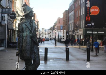 A statue to James Joyce, the famous Irish writer and creator of the book Ulysses, by artist Marjorie Fitzgibbon on a grey day. Dublin, Ireland Stock Photo