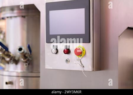 Industrial stainless steel control box with touch screen panel. Selective focus. Stock Photo