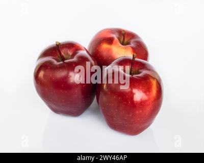 Three Red Delicious (Red chief) apples isolated on white background with reflection Stock Photo