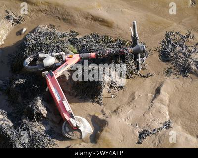 Voi electric scooter dumped in River Mersey Otterspool Liverpool Stock Photo