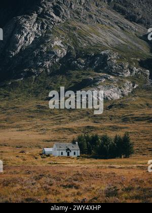 A lone typical white croft in the remote Highland summer landscape of Glencoe west Highlands Scotland UK - Scotland croft architecture landscape Stock Photo