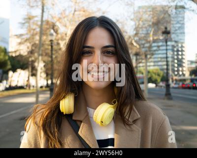 Portrait of a carefree smiling young woman in a city. Portrait of empowered woman Stock Photo