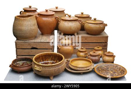 Homemade clay pots and plates. Isolated on white Stock Photo