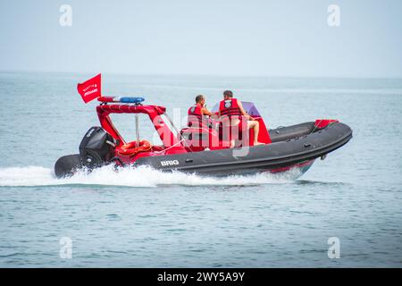 BAtumi, Georgia - 15th august, 2022- two rescue lifeguards patrol on black sea coast on electric boat. Batumi rescue team concept Stock Photo