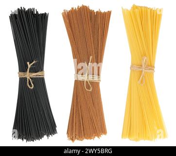 uncooked black, brown and yellow spaghetti isolated on white background Stock Photo