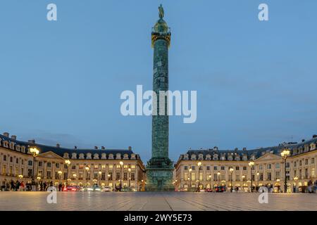 Paris, France - February 17, 2024 : Panoramic view of the illuminated Place Vendôme with its luxurious shops and hotels in Paris France Stock Photo