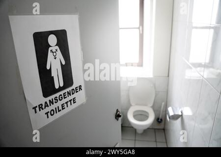 4 April 2024: Sign on the door of a toilet: Unisex toilet. WC for all genders. PHOTOMONTAGE ...