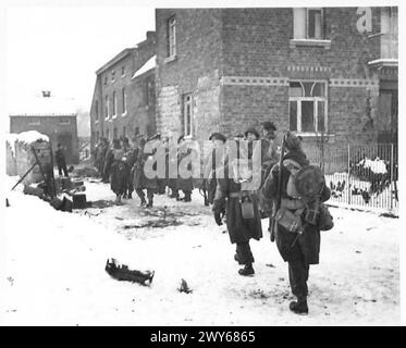 5TH SEAFORTH HIGHLANDERS PIPE BAND - Men of the 7th Black Watch, 152 Bde, 51 Highland Div., after two days in the line, going in to billets in Hotton to have their first sleep in 48 hours. , British Army, 21st Army Group Stock Photo