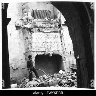 CAEN - NOW AND AS IT WAS - A feature of the hotel St. Valors d'Escoville was this ancient carved Fleurs de Lys on the old fireplace now in ruins. It had recently been restored by the Beaux Arts Society. , British Army, 21st Army Group Stock Photo