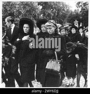 CEREMONIAL FUNERAL OF BRUSSELS POLICE SHOT BY THE GERMANS - Families following the hearses through the cemetery grounds , British Army, 21st Army Group Stock Photo