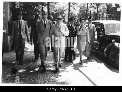 The Prime Minister and Anthony Eden walk along Kaiser Strasse in Berlin toward the Prime Minister's residence following the Big Three Conference. Stock Photo