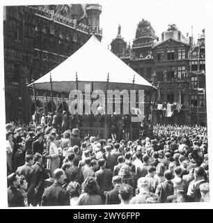 PEACE CELEBRATIONS IN BRUSSELS - Crowds gathered in the Grande Place to listen to the American Band. , British Army, 21st Army Group Stock Photo