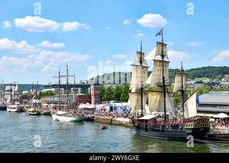 Rouen (northern France), June 15, 2023: 8th edition of the Rouen Armada (gathering of tall ships). View of sailboats moored on the River Seine and the Stock Photo
