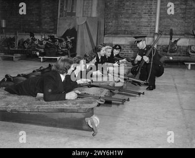 Marines receive instruction on a rifle course of fire at Altcar ...