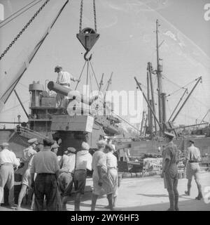 OPERATION PEDESTAL, AUGUST 1942 - August 1942 Operation Ceres: The unloading of supplies at Malta from the BRISBANE STAR: A heavy AA gun being lowered onto the quayside by a crane. , Stock Photo