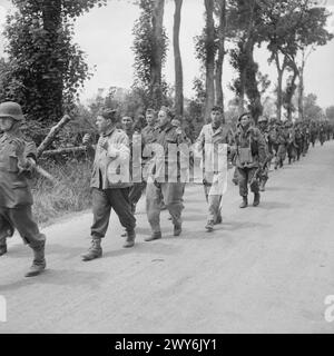 German troops escort British prisoners of war to the rear on 29 April ...