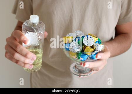 Young man pouring cologne to an elder man with a bowl of candy or chocolate. Eid al fitr in Turkey background video. Traditional Eid al Fitr candies. Stock Photo