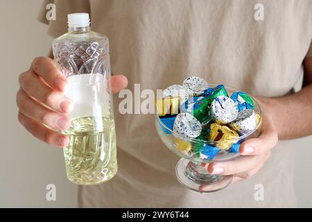 Young man pouring cologne to an elder man with a bowl of candy or chocolate. Eid al fitr in Turkey background video. Traditional Eid al Fitr candies. Stock Photo