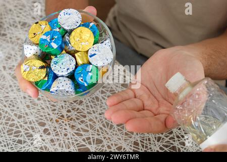 Young man pouring cologne to an elder man with a bowl of candy or chocolate. Eid al fitr in Turkey background video. Traditional Eid al Fitr candies. Stock Photo