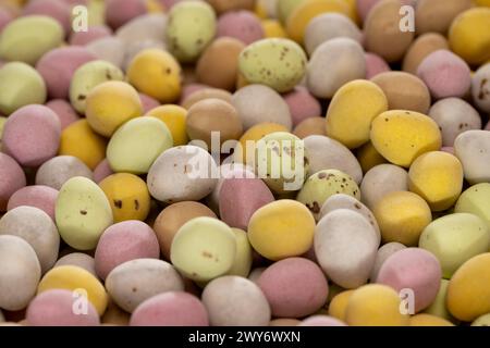 Pastel coloured, sugar coated chocolate mini eggs. Stock Photo