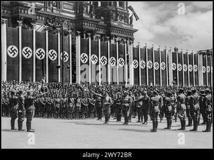 Adolf Hitler in Lustgarten salutes the banner of the Condor Legion. Next to him stand: General Hugo Sperrle (on the left), and on the right: Adm. Erich Raeder, Hermann Goering, General Wilhelm Keitel, General Wolfram von Richthofen. The Berlin Cathedral building can be seen in the background. Date 6 June 1939 Adolf Hitler salutes troops of the Condor Legion who fought alongside Spanish Nationalists in the Spanish civil war Berlin Nazi Germany Stock Photo