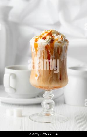 Iced Caramel Latte Topped With Whipped Cream And Caramel Sauce 