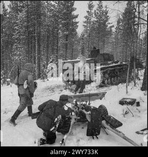 WW2 Nazi German and Finnish units 1942, accompanied by a PzKpfw III Ausf B tank, are advancing along a winter snowing forest road in the Kestenga Karelia USSR direction. In the foreground is a Finnish artilleryman soldier with a 37-mm anti-tank gun of the Swedish design 'Bofors' (37 PstK/36 Bofors). Stock Photo
