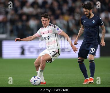 Turin, Italy. 2nd Apr, 2024. Andrea Cambiaso of Juventus turns with the ball as Luis Alberto of SS Lazio closes in during the Coppa Italia Semi-Final match at Allianz Stadium, Turin. Picture credit should read: Jonathan Moscrop/Sportimage Credit: Sportimage Ltd/Alamy Live News Stock Photo
