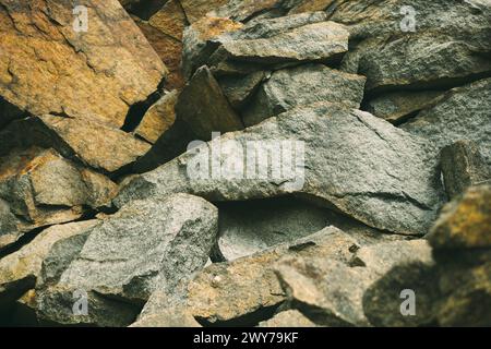 Large pile of stones. Stone rocks. Granite quarry. Abandoned industrial production. Stock Photo