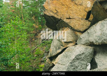 Large pile of stones. Stone rocks. Granite quarry. Abandoned industrial production. Stock Photo