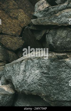 Large pile of stones. Stone rocks. Granite quarry. Abandoned industrial production. Stock Photo