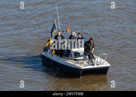 Port of London Authority Harbour Master boat at University Boat Race with camera operator, at Mortlake, London, UK. Powercat boat Stock Photo